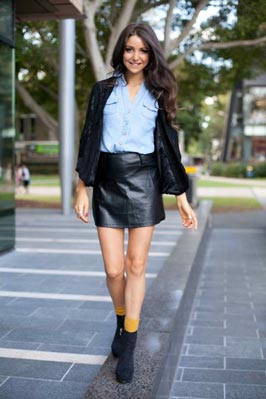 Australian supermodel Aley Greenblo in denim shirt and leather mini-skirt