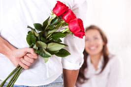 Man spoiling woman with flowers