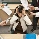 The woman is burying her head in her hands