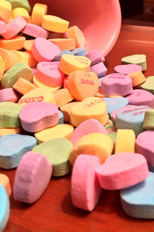 Coulourful heart-shaped candies.
