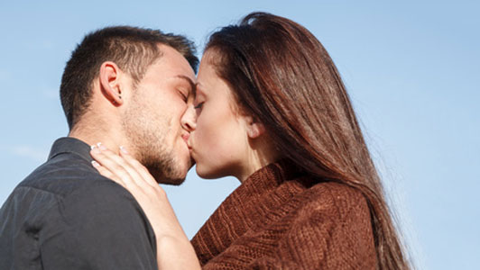 close up of couple kissing