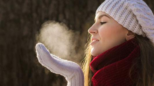 visible breath of woman in the cold