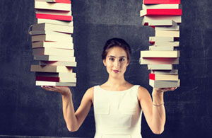 woman holding up books