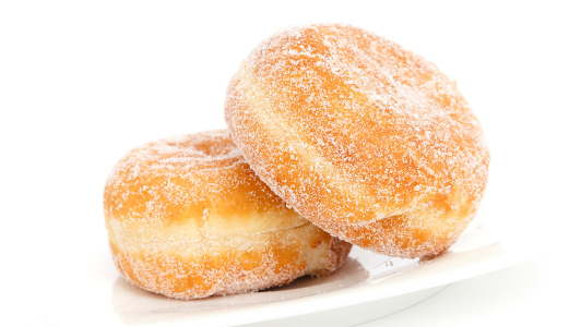 Two doughnuts sprinkled with sugar.