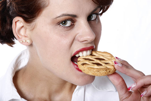 bad woman eating a danish