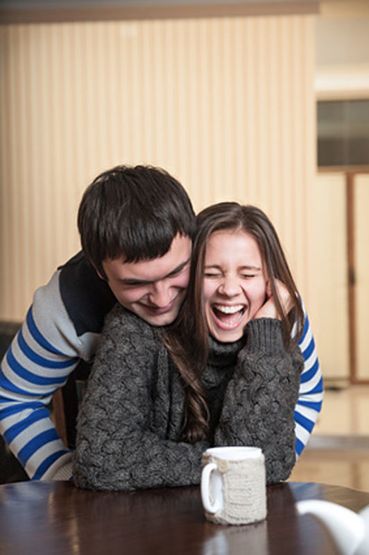 girl getting tickled by boyfriend