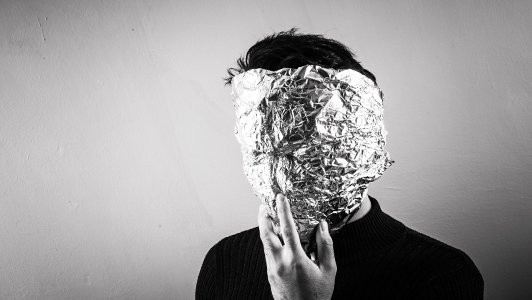 Guy wearing a tin foil mask.