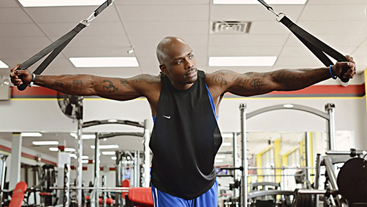 Tattooed guy in a gym