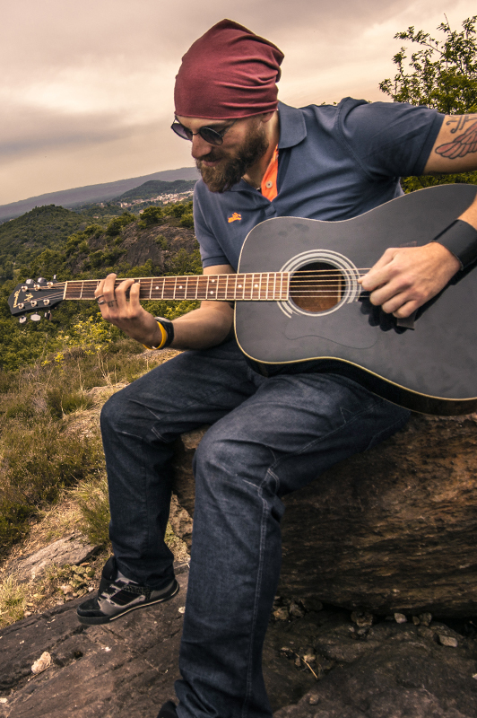 Guy playing a guitar.