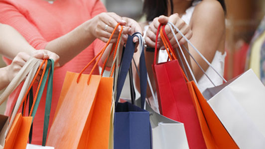 group of women with shopping bags held in