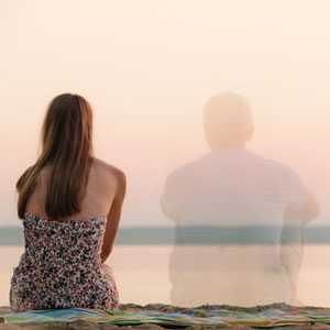 women sitting watching sunset in absence of man