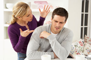 Woman and a man arguing in the kitchen