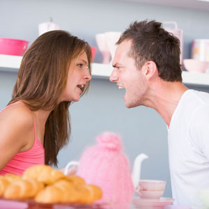 Guy and girl fighting in kitchen