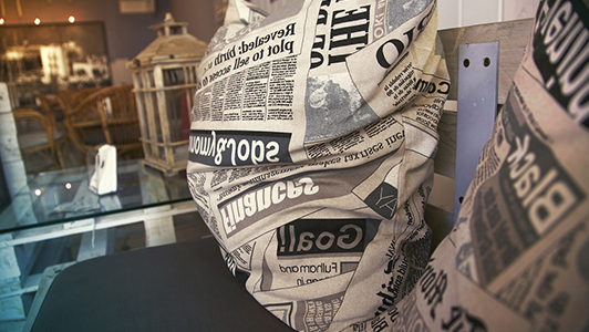 Pillows with newspaper print.