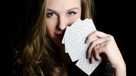 girl holding cards