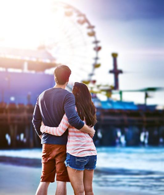 couple overlooking ferris wheel