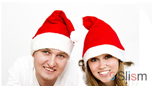 a couple wearing christmas hats