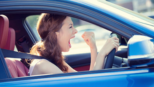 frustrated girl stuck in blue car