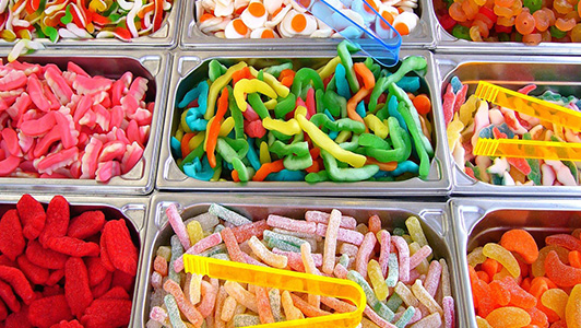 Racks with different gummy candies