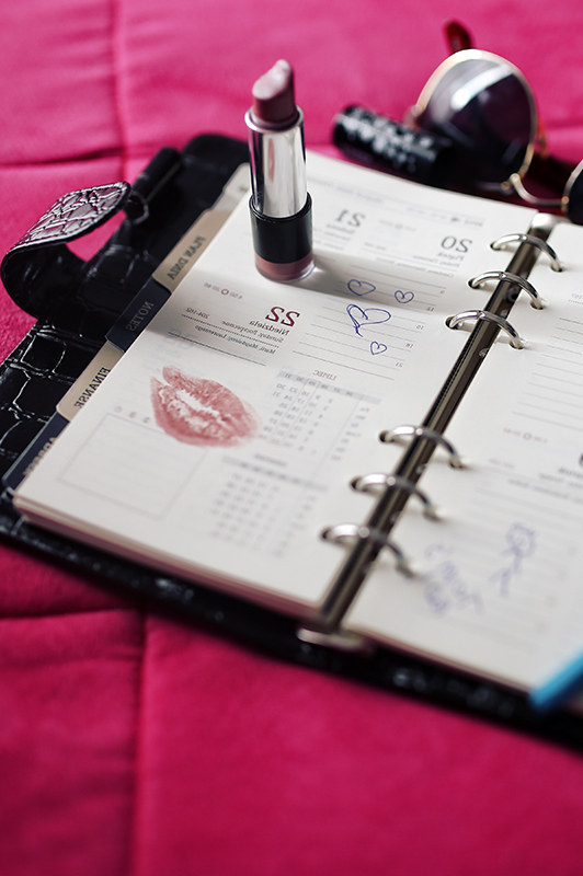 Agenda, lipstick, and sunglasses