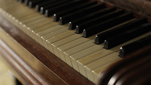 close-up of an old piano