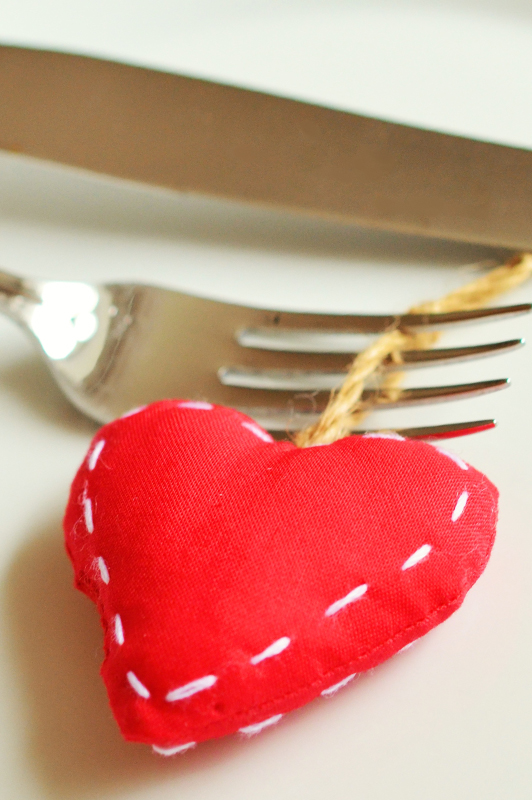 Red fabric heart attached to a fork