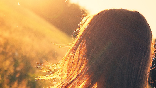 Hair of a girl walking in the field