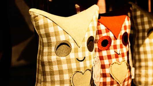 two owl pillows set side by side