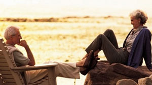 Elderly couple sitting outdoors