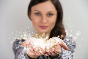 Woman holding light in her hands