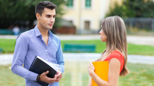 students talking in courtyard