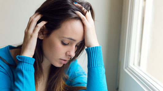 depressed young woman in blue