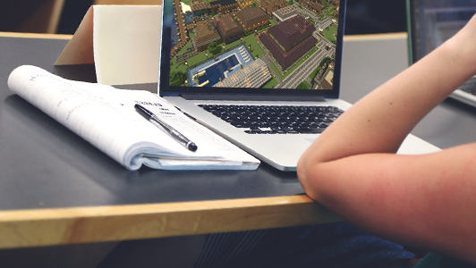 Girl playing a game on laptop