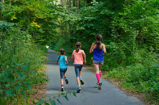 mother and daughters running together