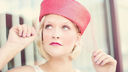 Blonde girl with a pink hat with a net.