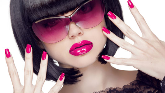 women with pink sunglasses makeup and nails