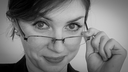 A girl looking over her glasses