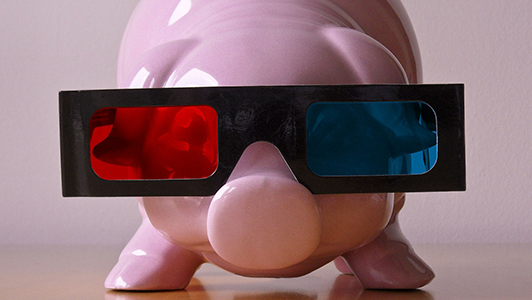 Pink piggy bank with 3d glasses.