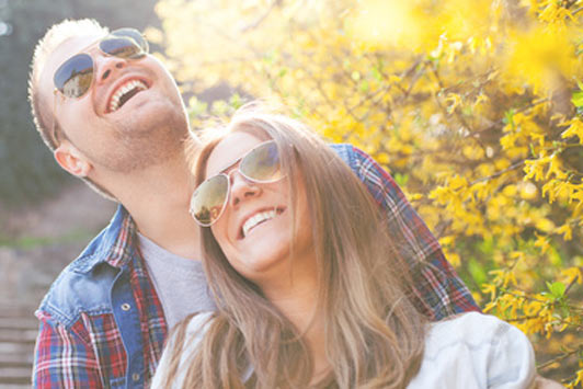 man and woman laughing together