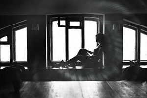 woman sitting by window