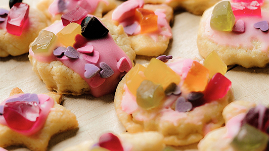 Cookies with pink frosting and hearts.