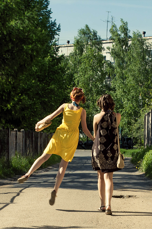 Two girls in summer dresses.