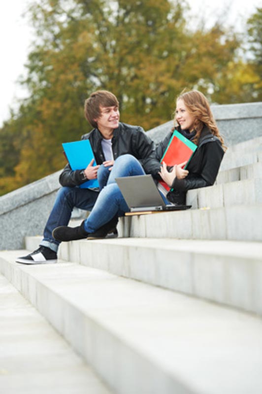 guy and girl talking on steps outdoors