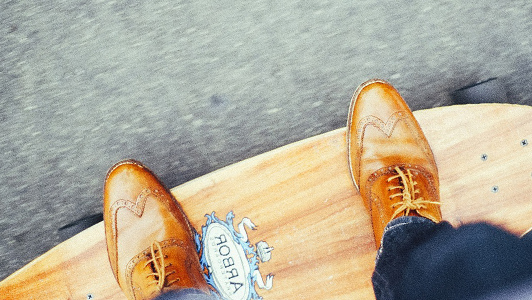 Guy with brown shoes on a skateboard