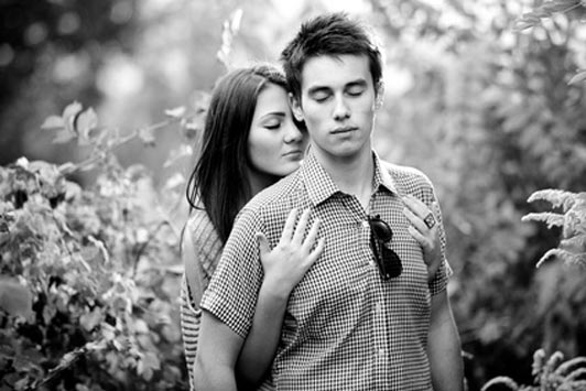 girl holding on tightly to guy being calmed