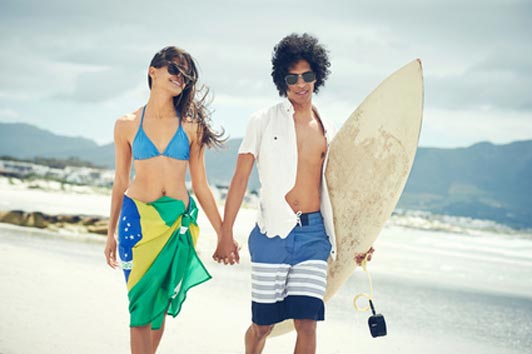 teens at the beach on surfing date