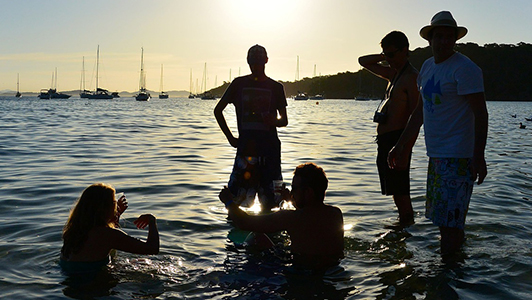 Several friends hanging out in water