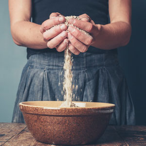 woman with a handful of oats