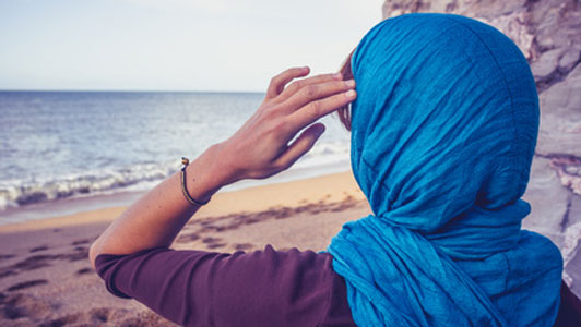 woman in blue head scarf