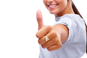 Smiling woman showing thumbs up
